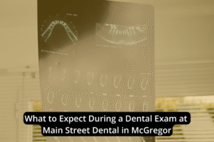 Dental X-ray images displayed on a light board, with a caption overlay about comprehensive dental exams at Main Street Dental in McGregor.